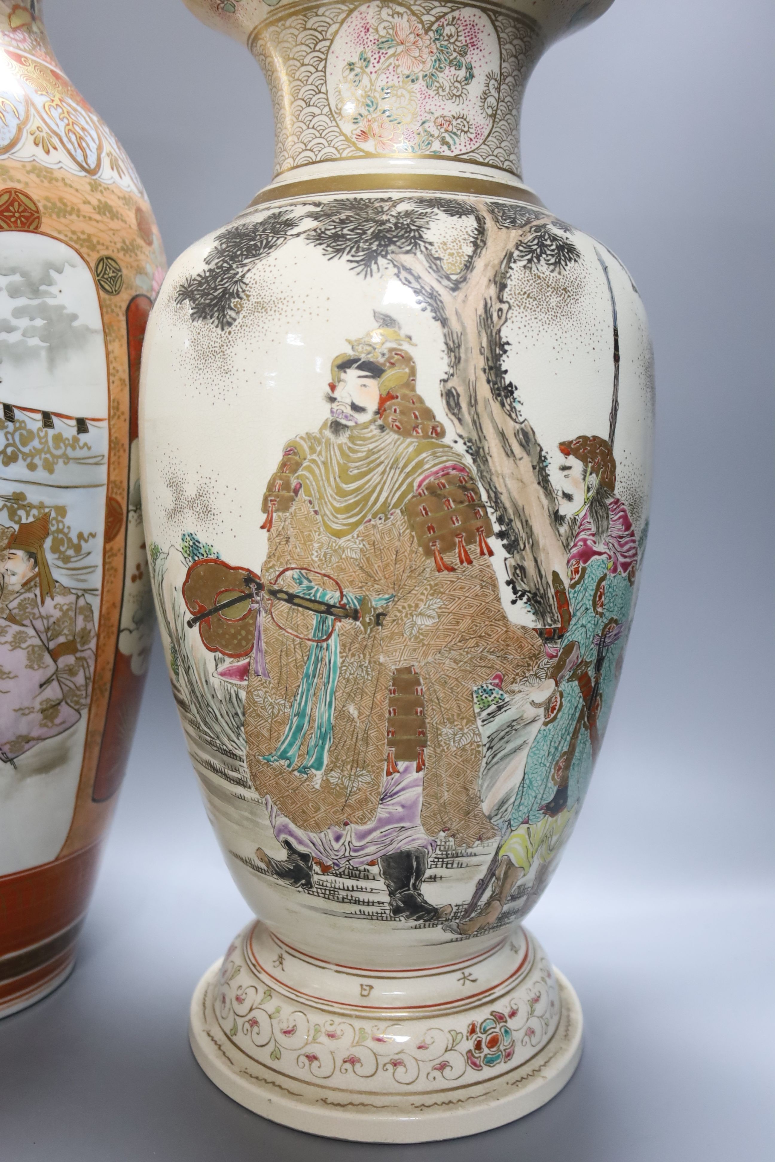 A large Japanese Kutani porcelain vase and a large Japanese Satsuma pottery vase, impressed Kozan mark, both restored 46cm